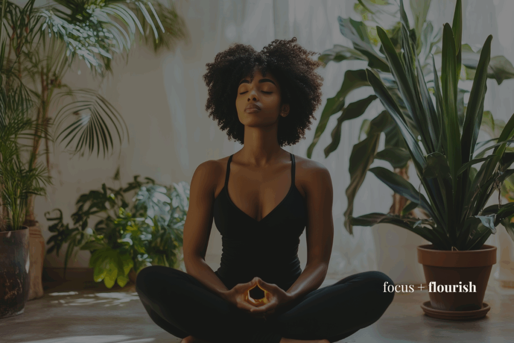 Woman doing breathwork in her living room